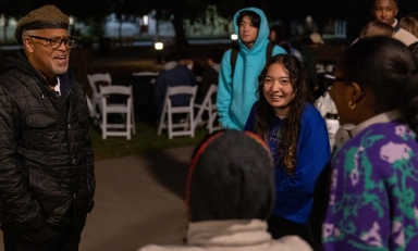 President Elam talks to students at Moonlight Breakfast on the Quad in December 2022.