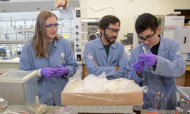 Prof. Jeffrey Cannon and students in the chemistry lab