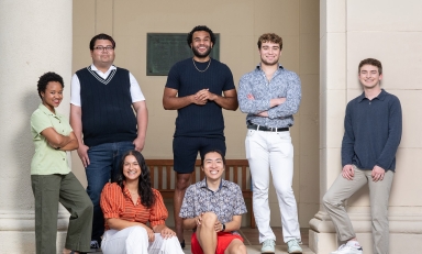 a group of 7 Obama Scholars students standing together outside