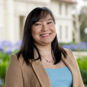 Nenuca Cariaga Professional Portrait, wearing tan blazer and blue blouse