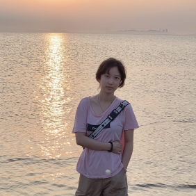 Sherry Gao in front of a sunset