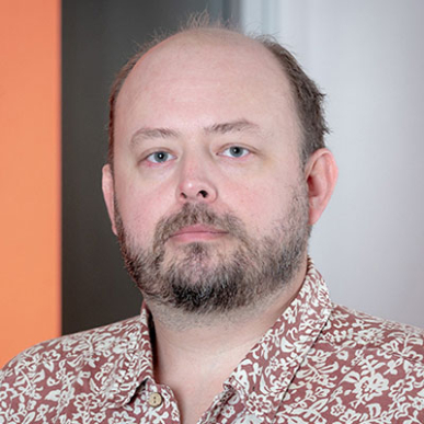Eric Bjorklund headshot with collared shirt