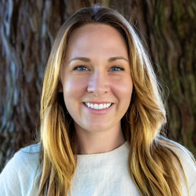 Claire Willing headshot long blonde hair white shirt