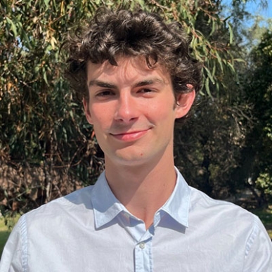Connor McConnell headshot in blue shirt