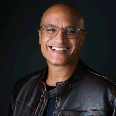 leo olebe headshot with black leather jacket