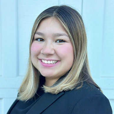 Olivia Okamoto headshot with blue blazer