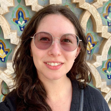 Tatum Katz headshot sunglasses black shirt