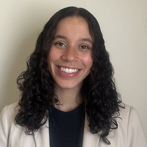 Oxy alumna Danielle Shores in a white medical coat
