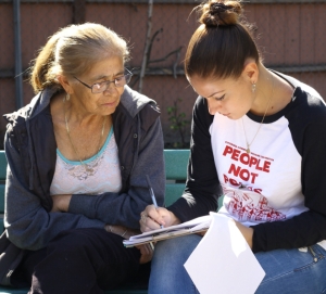 Sofia Polo ’16 completes a survey with a South L.A. resident. Sofia Polo ’16 completes a survey with a South L.A. resident.