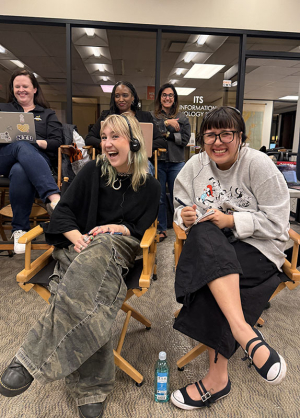 Two Occidental students on set at a television commercial shoot in the library building on campus