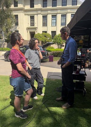 Occidental students Diana and Kiera, speaking with Liberty Mutual production staff