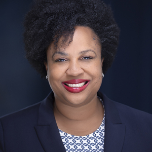 Namandje Bumpus headshot with navy blazer