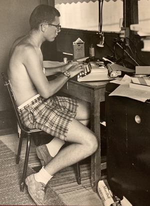 Richard Carlson at his typewriter in Vietnam.