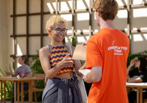 An Occidental student talks with a new student in Cannon Plaza