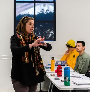 Occidental College professor Clair Morrissey teaching in a classroom