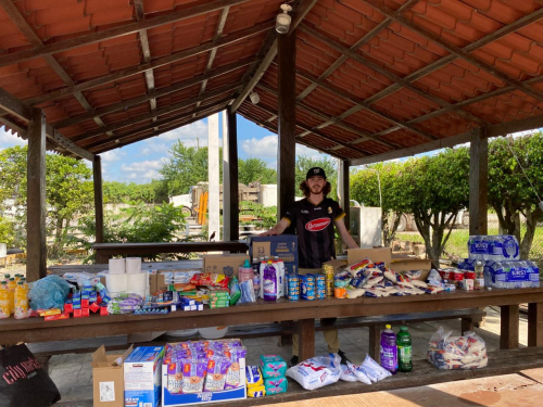 Aidan with supplies for flood victims