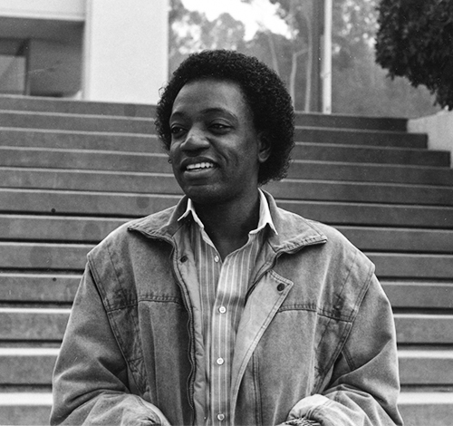 Saint-Aubin on the steps next to Johnson Hall in a 1986 photo.