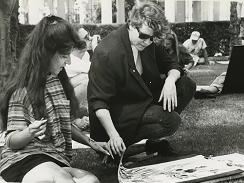 Besemer reviews a student’s work during an art class on the front lawn of Weingart in April 1992. Besemer reviews a student’s work during an art class on the front lawn of Weingart in April 1992.