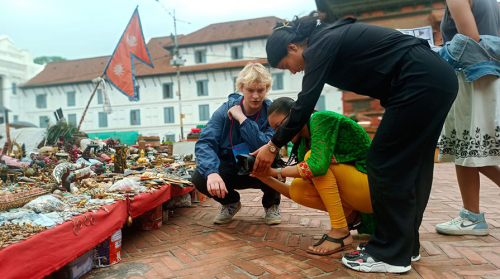 Oxy students at an open-air market in Nepal