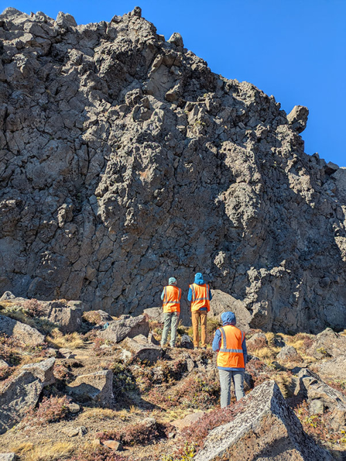 Oxy students and their professor doing geology research in the mountains of New Zealand