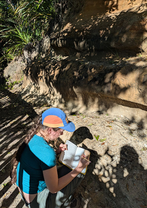 Occidental student Maggie Smith '28 gathering geology data in the field in New Zealand