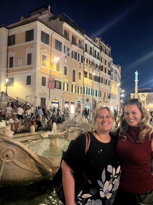 Liisa H and friend ext white bldg bg