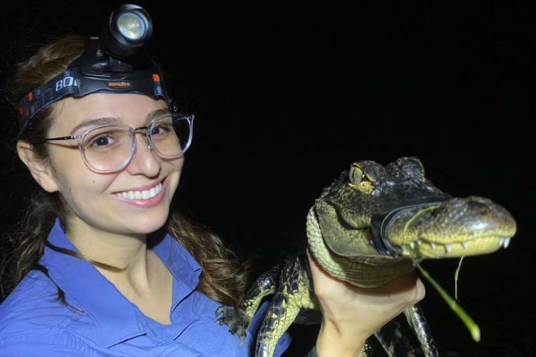 Yeraldi Loera holding alligator